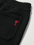 AMI PARIS - Tapered Logo-Embroidered Organic Cotton-Jersey Sweatpants - Black