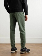 Stone Island - Tapered Logo-Appliquéd Garment-Dyed Cotton-Jersey Sweatpants - Green