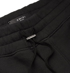 AMIRI - Tapered Printed Loopback Cotton-Jersey Sweatpants - Black