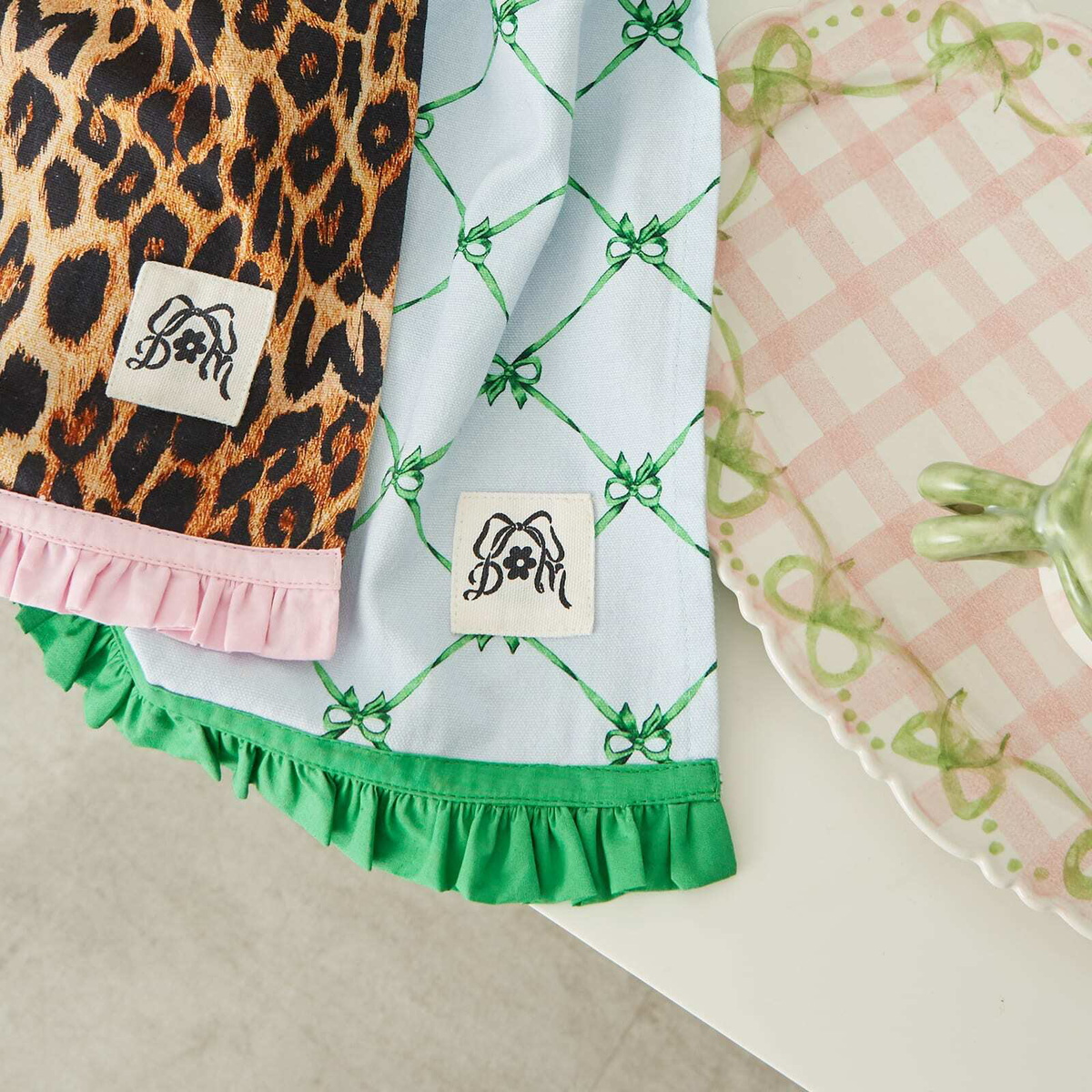 Damson Madder Women's Set of Two Ruffle Tea Towels in Leopard/Blue Bows 