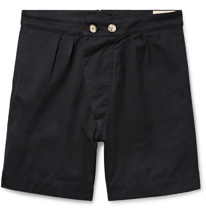 Photo: Holiday Boileau - Pleated Cotton-Twill Shorts - Midnight blue