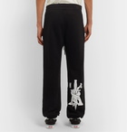 AMIRI - Tapered Printed Loopback Cotton-Jersey Sweatpants - Black