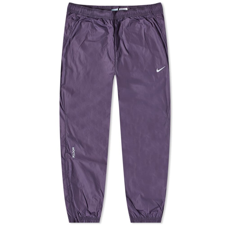 Photo: Nike Men's Nocta Track Pant in Dark Raisin/Cobalt Tint