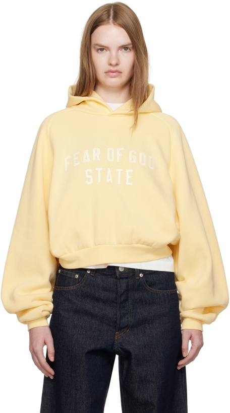 Photo: Fear of God ESSENTIALS Yellow Fleece Raglan Hoodie