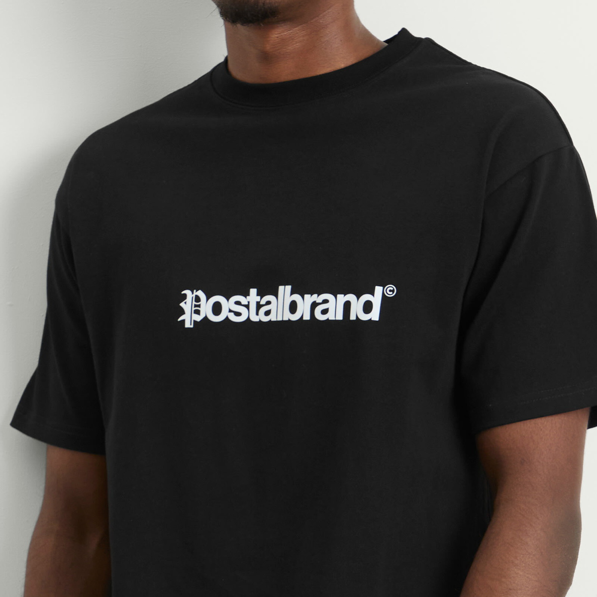POSTAL Men's Headline T-Shirt in Black