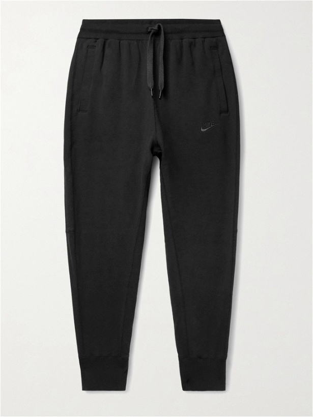 Photo: NIKE - Sportswear Tapered Logo-Embroidered Loopback Cotton-Jersey Sweatpants - Black