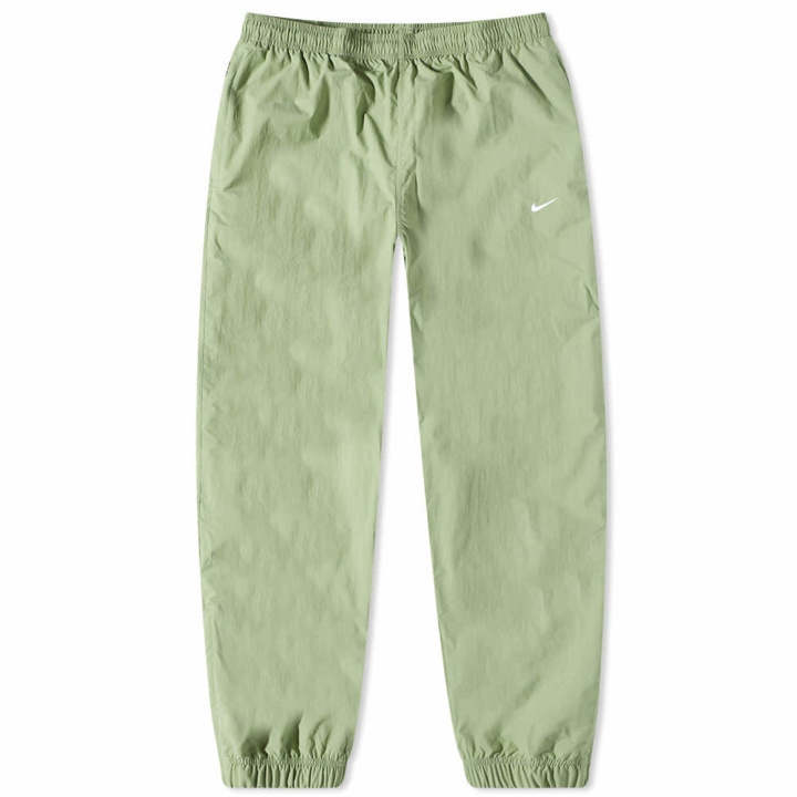 Photo: Nike Men's Solo Swoosh Nylon Track Pant in Oil Green/White
