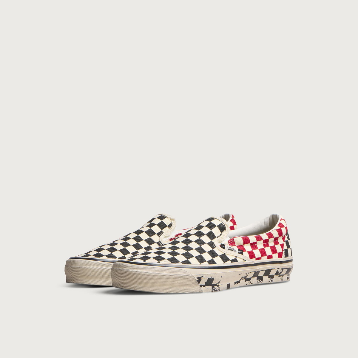 Vans Men's A.O.D. LX Classic Slip-On 98 in Black/Red Checkerboard