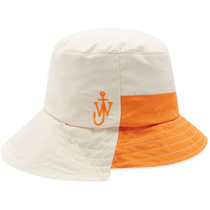 Photo: JW Anderson Men's Asymmetric Bucket Hat in White/Orange