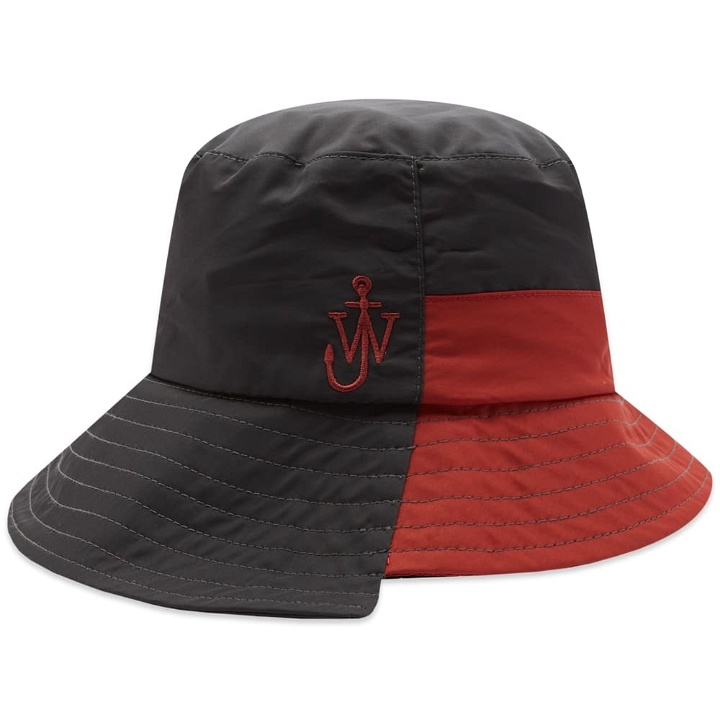 Photo: JW Anderson Men's Asymmetric Bucket Hat in Black/Red