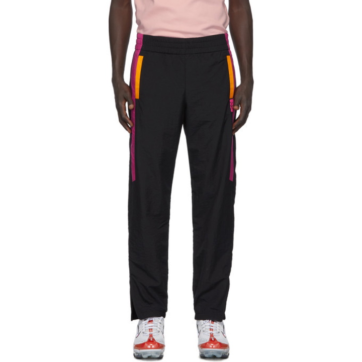 Photo: GCDS Black and Pink Nylon Track Pants