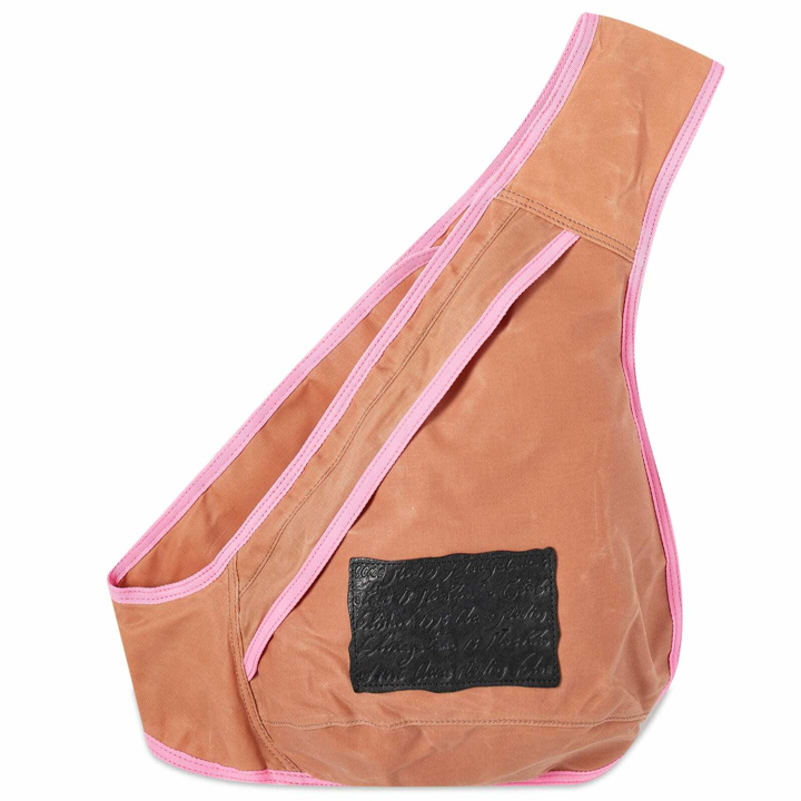 Photo: Acne Studios Men's Andemer Wax Sling Bag in Pink/Fluo Pink