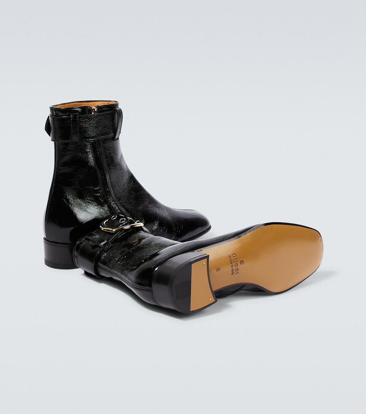 Gucci Buckled patent leather boots