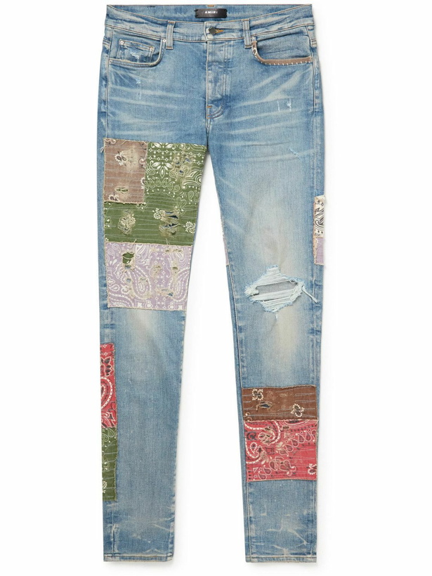 Photo: AMIRI - Skinny-Fit Cotton-Appliquéd Distressed Jeans - Blue