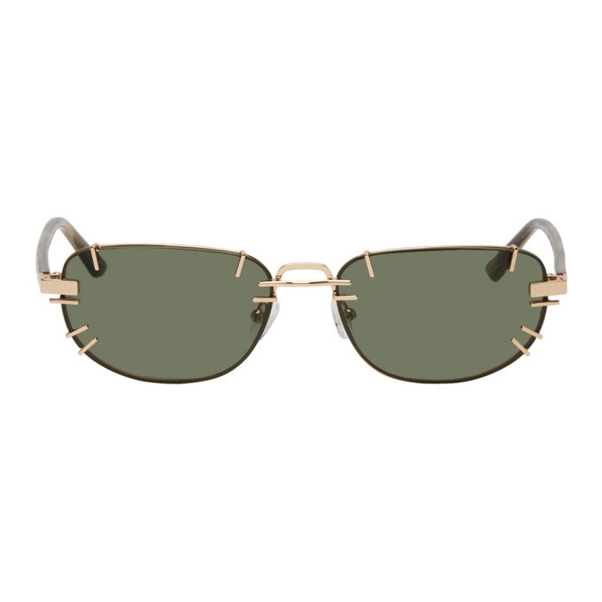 Photo: Y/Project Gold and Green Linda Farrow Edition Trinity Sunglasses