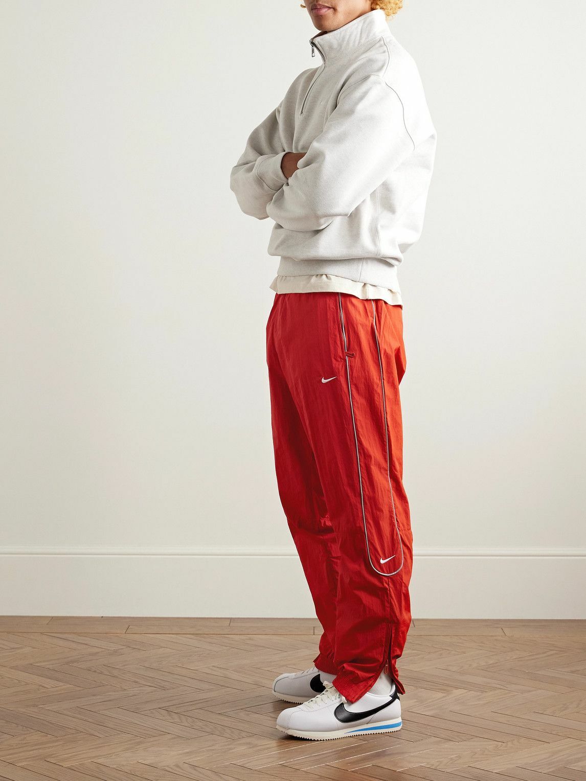 red nike track pants
