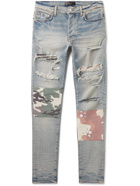 AMIRI - Skinny-Fit Patchwork Distressed Stretch-Denim Jeans - Blue