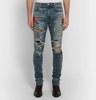 AMIRI - Skinny-Fit Appliquéd Panelled Distressed Stretch-Denim Jeans - Men - Mid denim