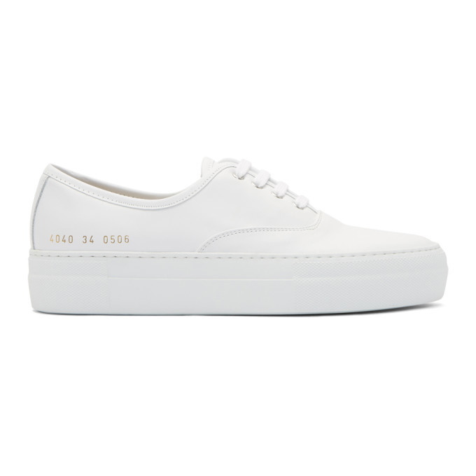 Photo: Woman by Common Projects White Tournament Four Hole Sneakers