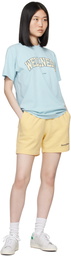 Sporty & Rich Yellow Serif Logo Gym Shorts