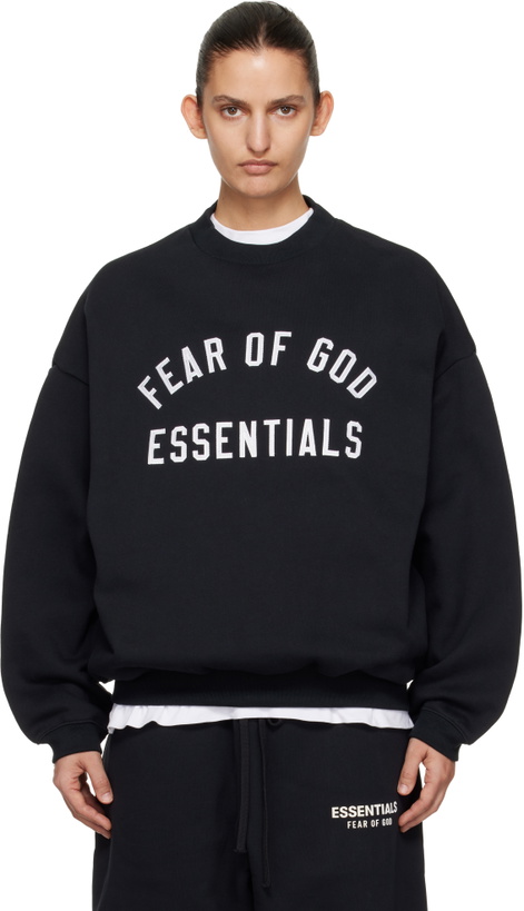 Photo: Fear of God ESSENTIALS Black Varsity Crewneck Sweatshirt