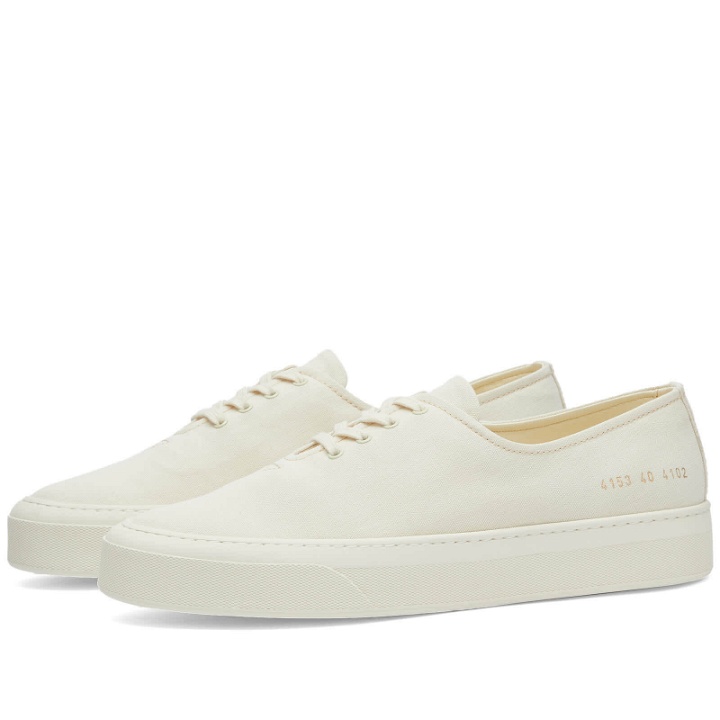 Photo: Woman by Common Projects Women's Four Hole Canvas Sneakers in Off White
