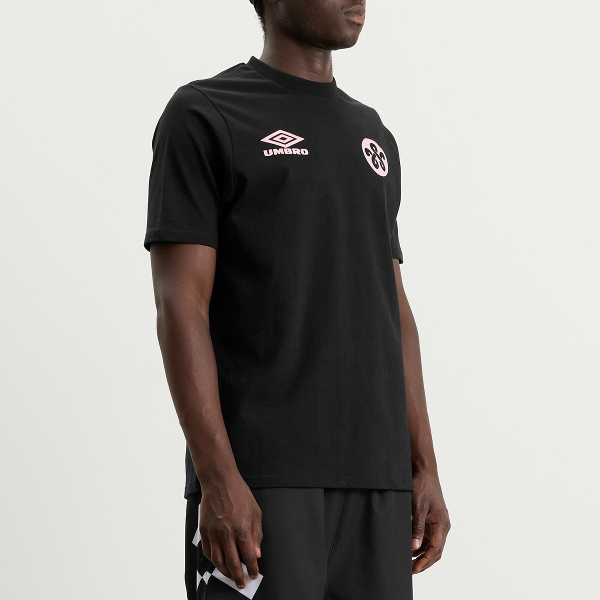 Umbro Men's x WOEI Logo T-Shirt in Black/Pink