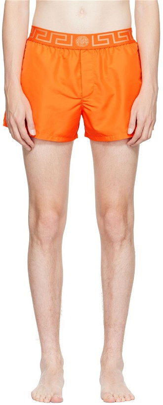 Photo: Versace Underwear Orange Greca Swim Shorts