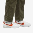 Nike Men's Cortez Sneakers in White/Campfire Orange