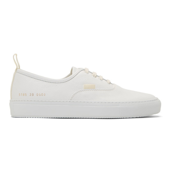 Photo: Common Projects White Four Hole Leather Low Sneaker