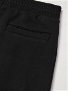 Givenchy - Tapered Printed Cotton-Jersey Sweatpants - Black
