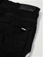 AMIRI - Skinny-Fit Appliquéd Distressed Jeans - Black