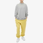 Nike Men's Solo Swoosh Fleece Pant in Saturn Gold/White