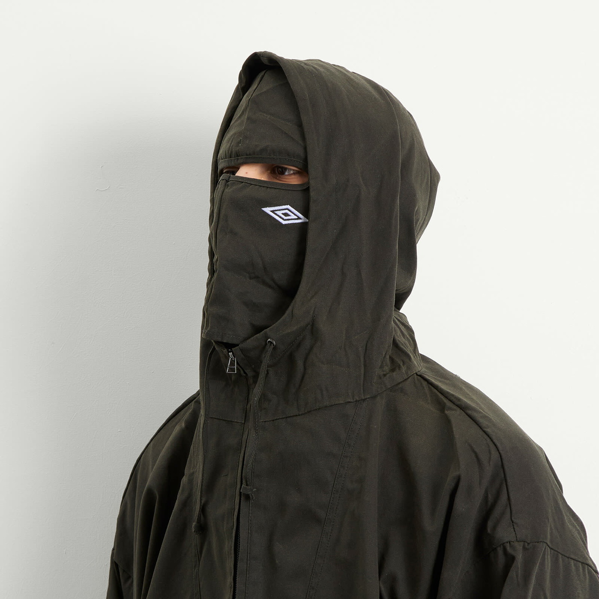 Umbro by Slam Jam Men's Masked Waxed Anorak in Dark Olive