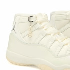 Air Jordan Women's 11 Retro W Sneaker in Sail/Pearl Grey/White/Mtlc Silver