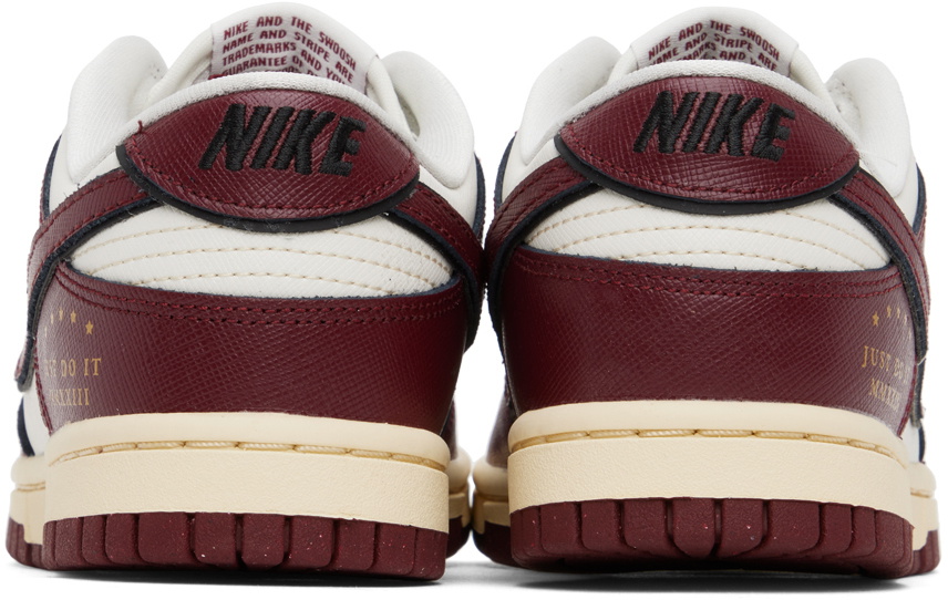 white nike sneakers with red swoosh