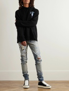 AMIRI - Skinny-Fit Logo-Appliquéd Distressed Jeans - Blue