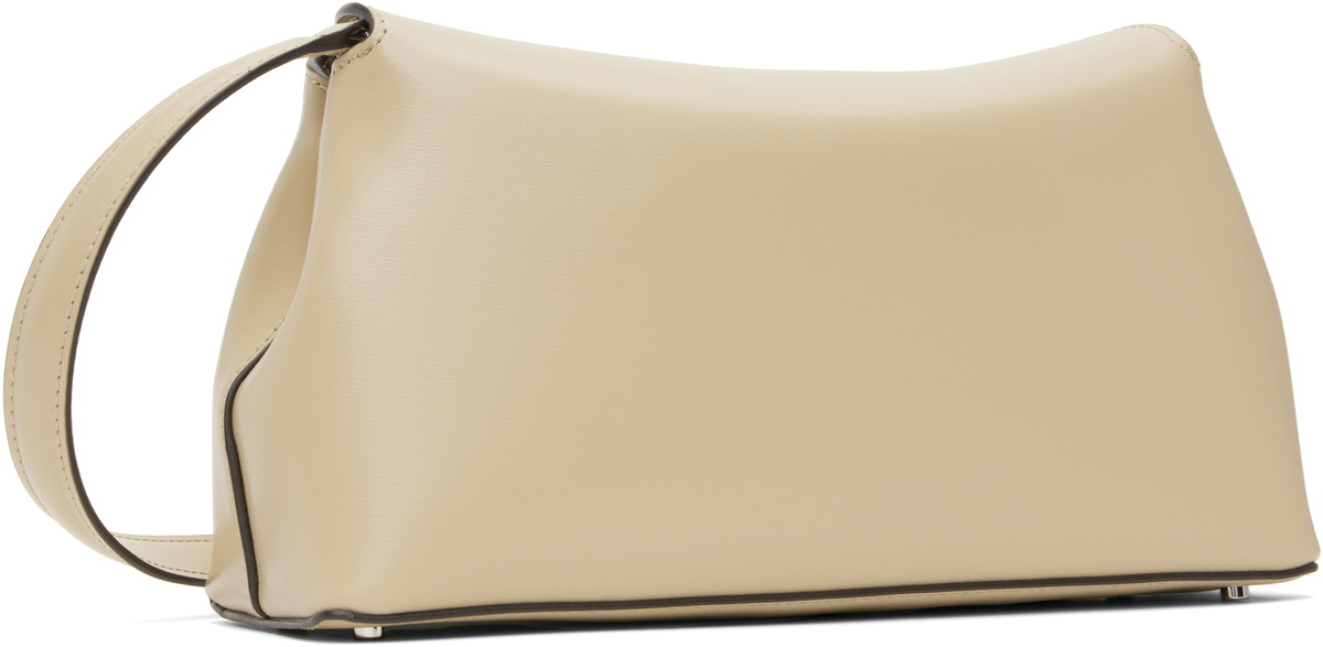 24AW new/toteme T-Lock シアリングクラッチ Bag Cream T-Lock leather clutch in beige - Toteme | Mytheresa