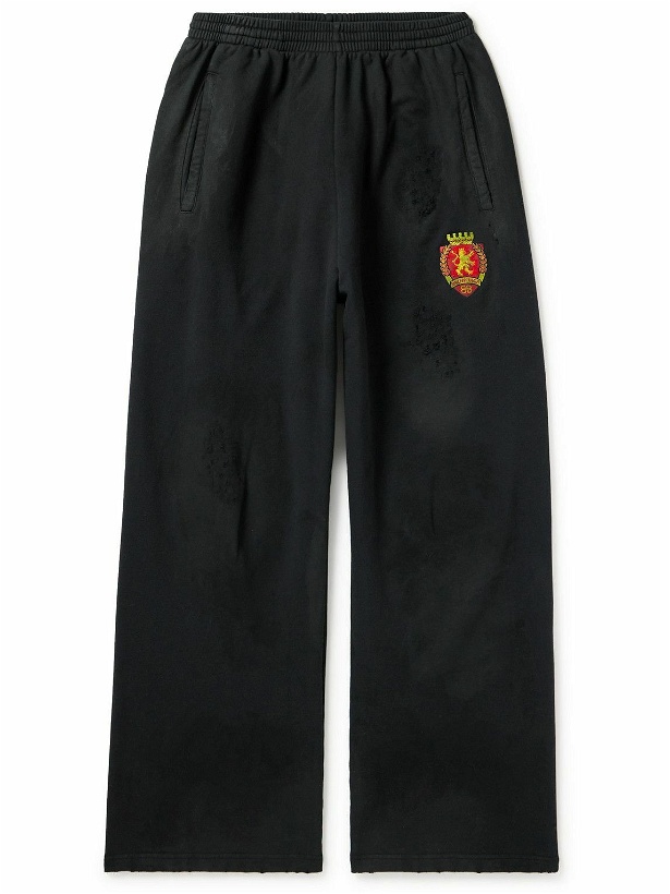 Photo: Balenciaga - Wide-Leg Distressed Logo-Appliquéd Cotton-Jersey Sweatpants - Black