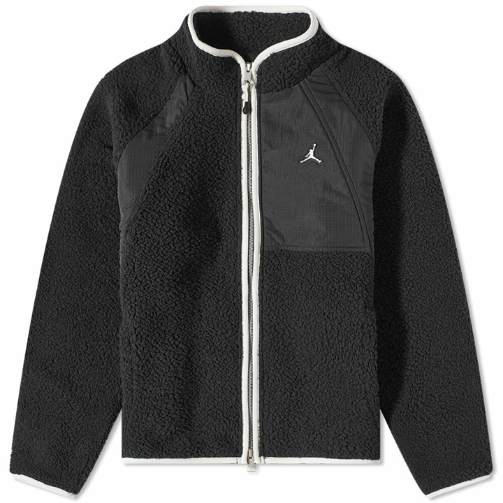 Photo: Air Jordan Men's Essential Fleece Winter Top in Black/Sail