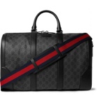 Gucci - Leather-Trimmed Monogrammed Coated-Canvas Holdall - Black