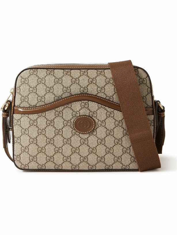 Photo: GUCCI - Leather-Trimmed Monogrammed Coated-Canvas Messenger Bag