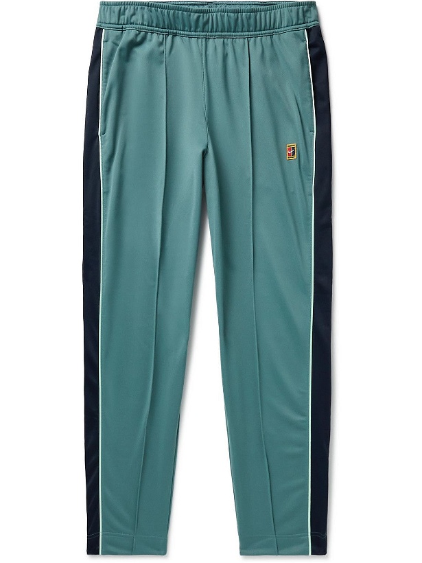 Photo: Nike Tennis - Court Heritage Tapered Recycled Tech-Jersey Tennis Trousers - Green