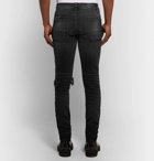 AMIRI - Skinny-Fit Distressed Stretch-Denim Jeans - Men - Black