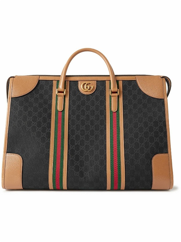 Photo: GUCCI - Leather and Webbing-Trimmed Monogrammed Coated-Canvas Duffle Bag