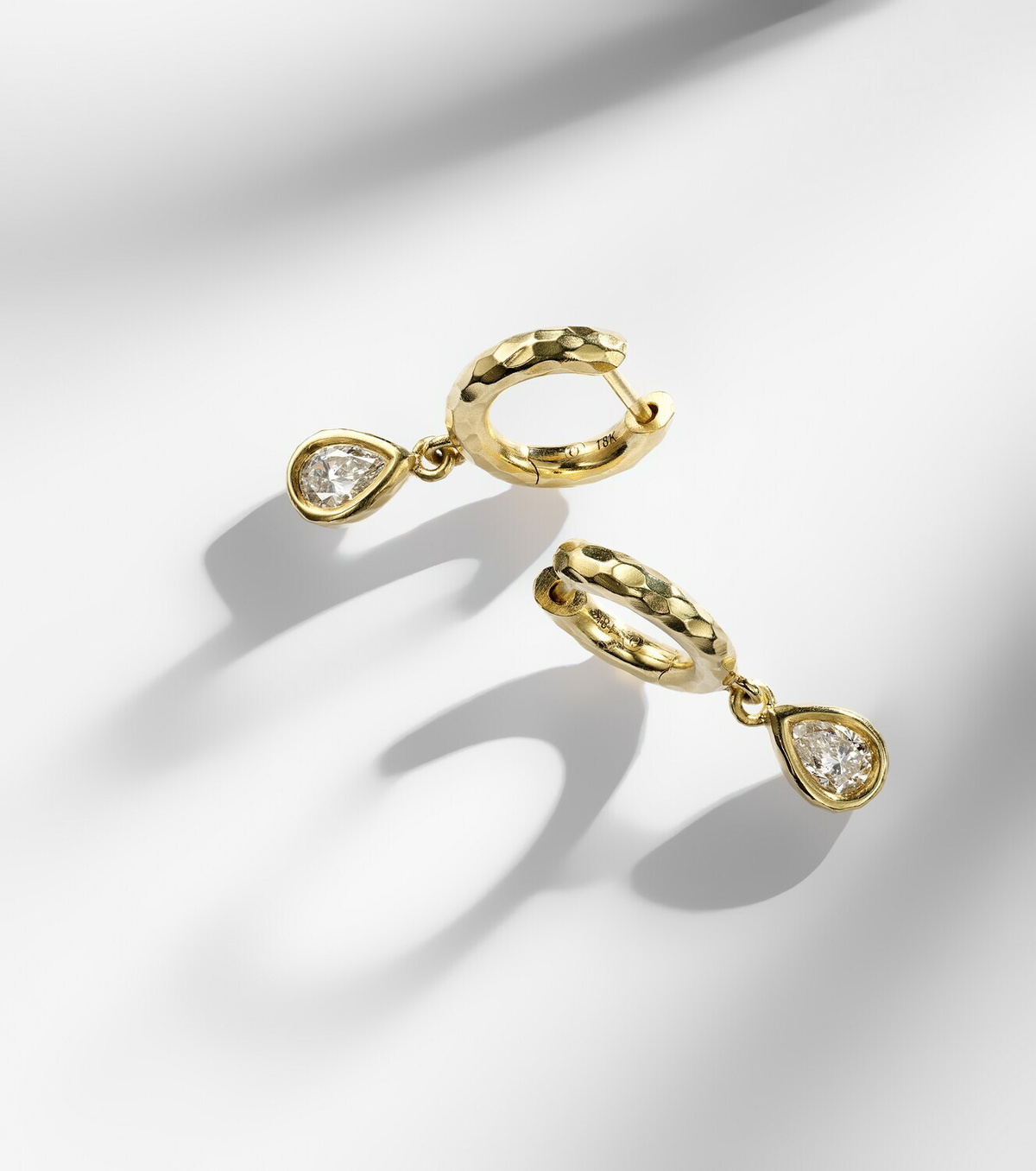 Octavia Elizabeth Hidden Gem 18kt gold huggies with diamonds