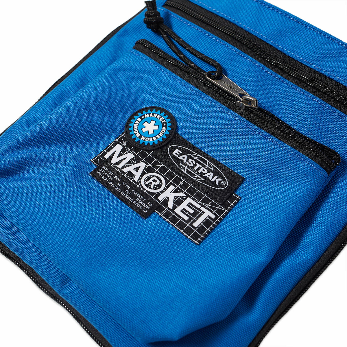 Eastpak Men's x Market Rusher Bag in Blue 