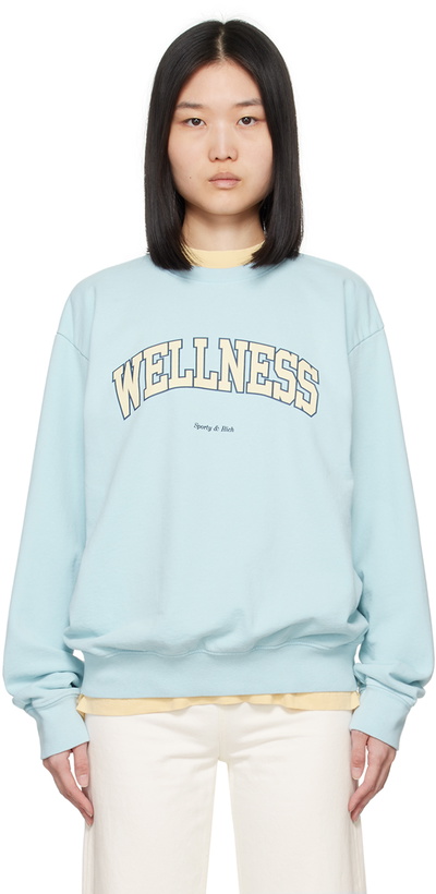 Photo: Sporty & Rich Blue Wellness Ivy Sweatshirt