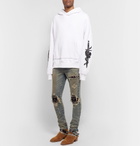 AMIRI - MX1 Skinny-Fit Rib-Panelled Distressed Stretch-Denim Jeans - Men - Blue