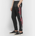 AMIRI - Slim-Fit Tapered Embroidered Webbing-Trimmed Tech-Jersey Track Pants - Black